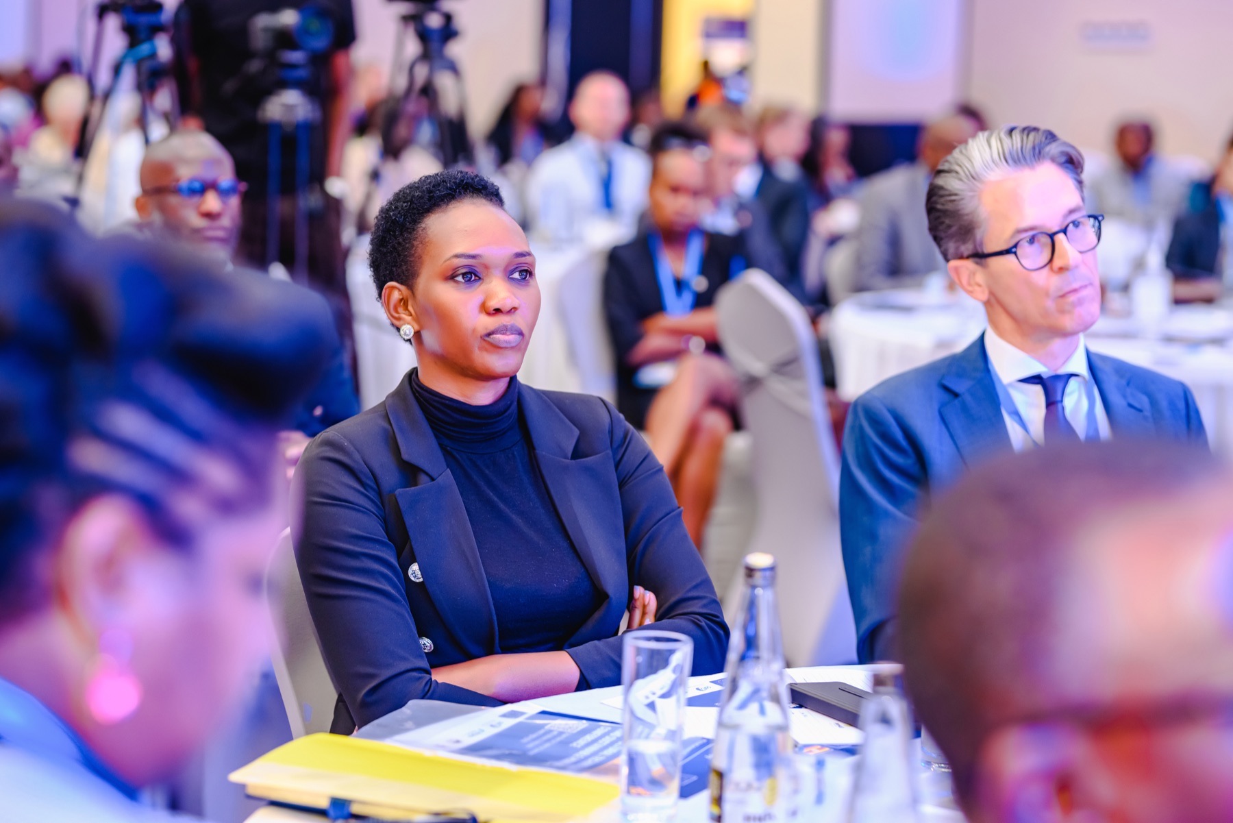 Corporate conference delegates focused on a live presentation