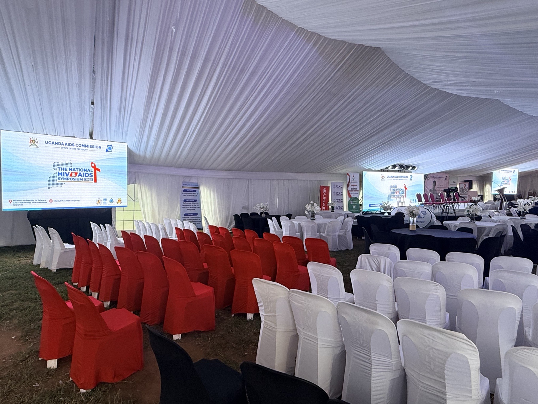 National HIV and AIDS Symposium venue arranged beneath a production tent