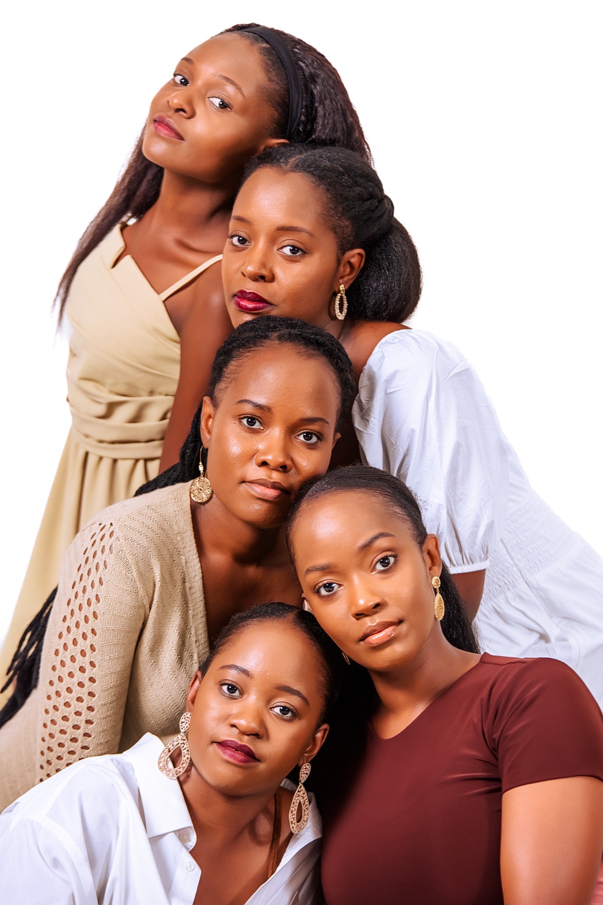 Group studio portrait of six women against a white background