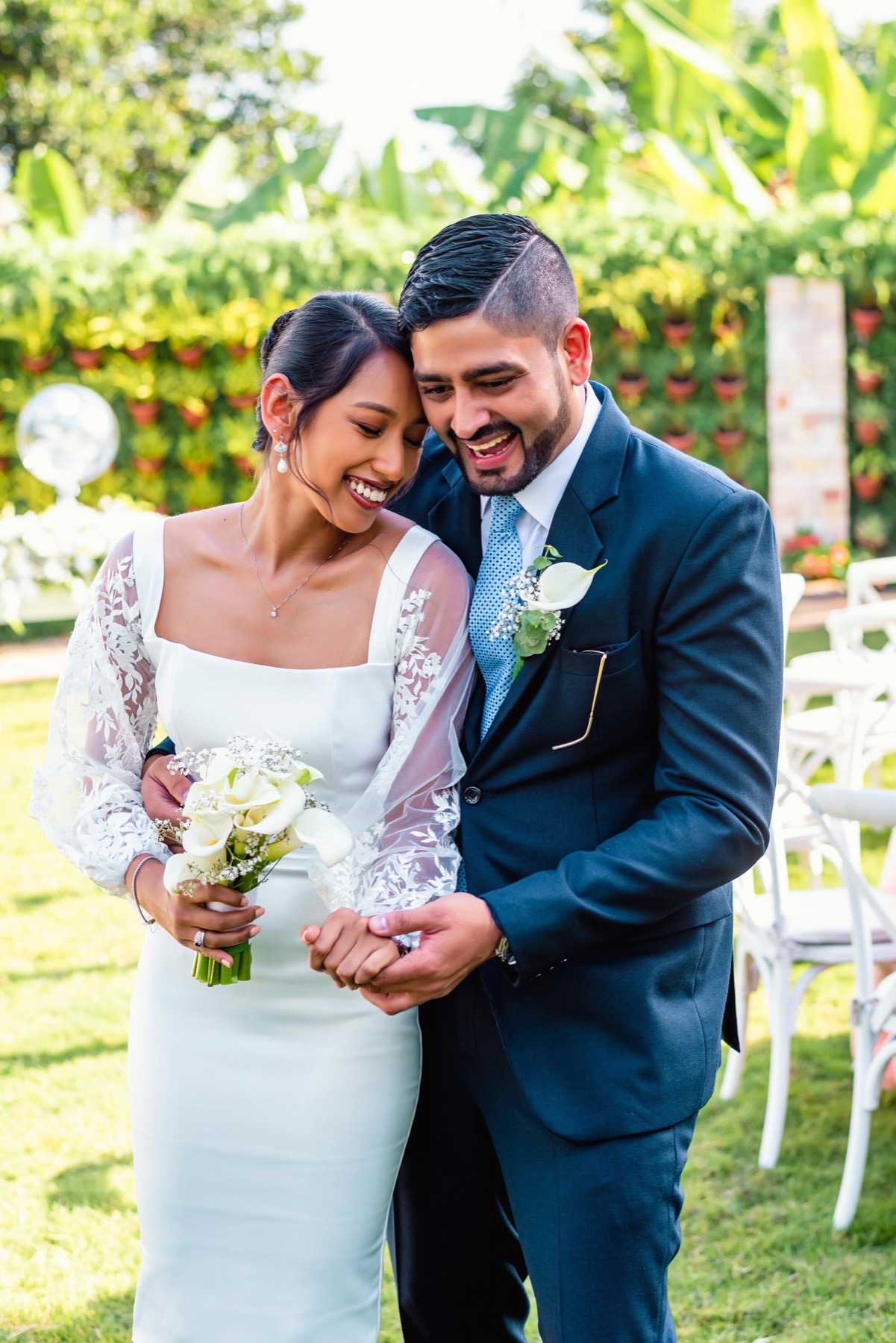Newlywed couple smiling together outdoors