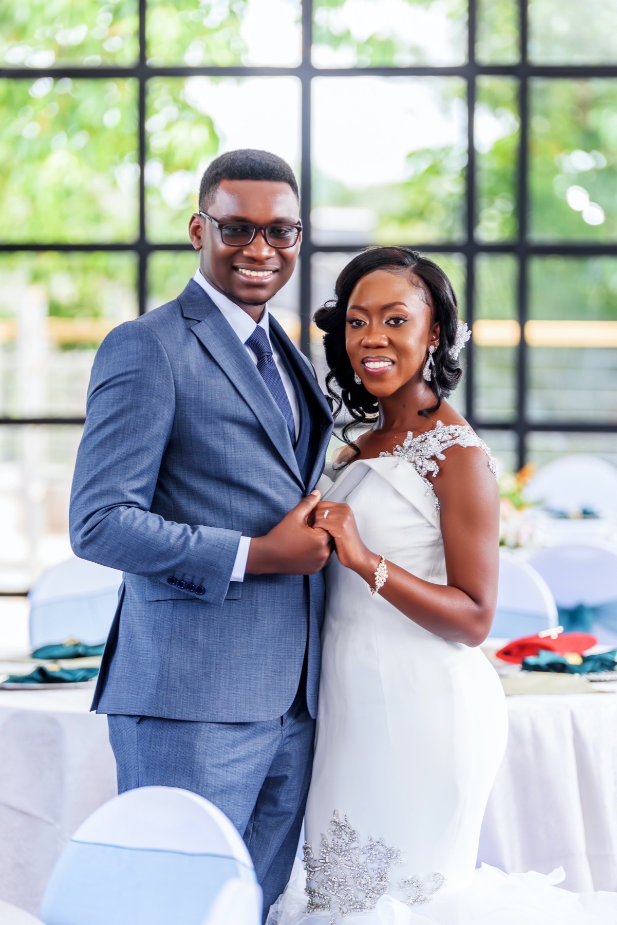 Bride and groom standing together at their reception