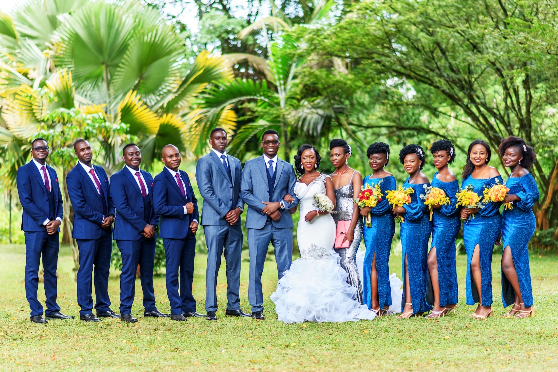 Wedding party gathered for a formal garden portrait
