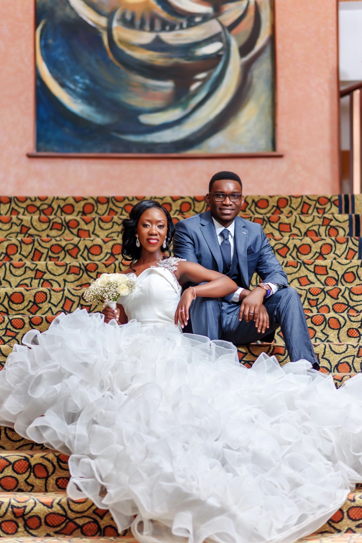 Bride and groom seated together for a formal portrait